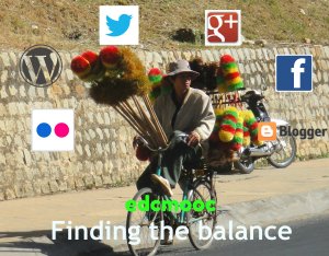salesman on a bicycle in Dalat, Vietnam laden with dusters on sticks. Overlaid with logos of well-known online networking sites